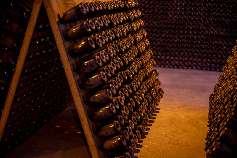 A cellar full of aging Champagne bottles